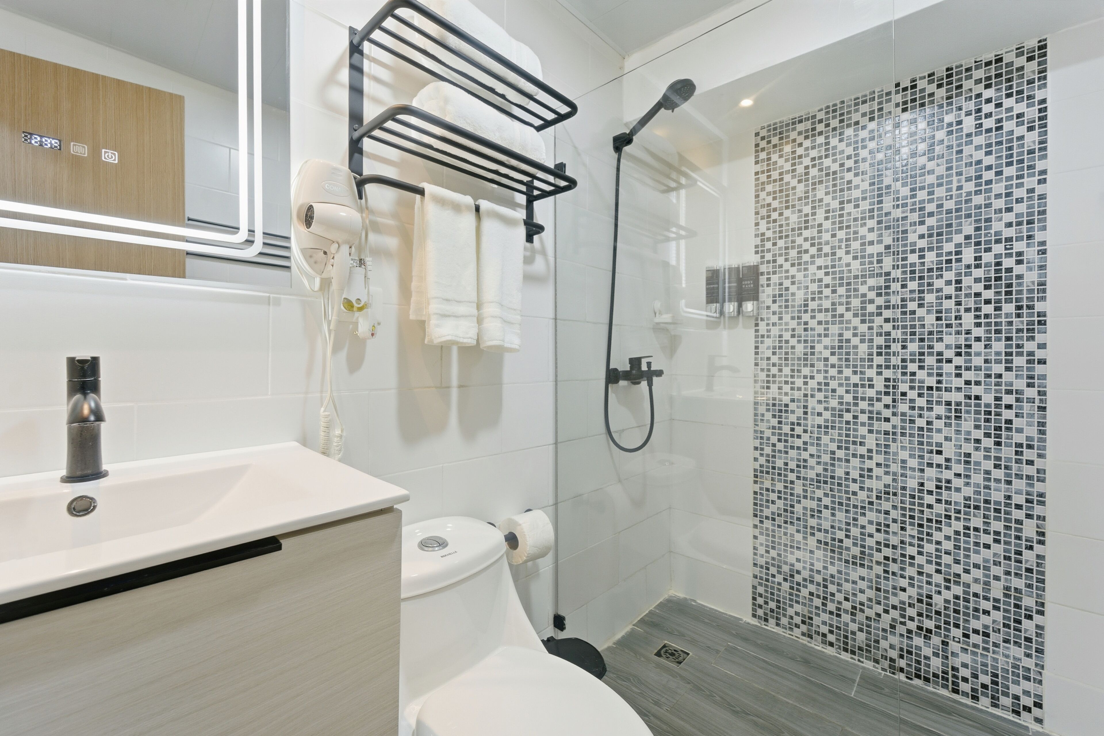 Shower, hair dryer, towels, soap