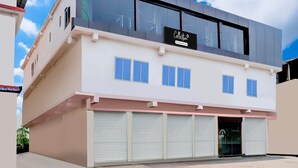 A modern two-story building with a sign reading 'Collection.' - Classic With Balcony Ganeshguri Nayanpur (Guwahati)