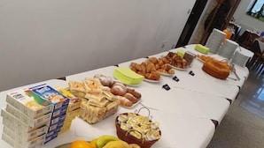 A buffet table with various food items including fruits, pastries, and bread. - Hotel Terme Ristorante (Acquasanta Terme)