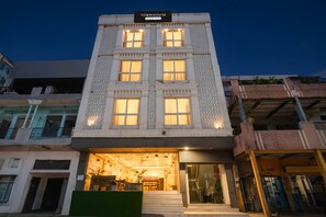 A multi-story building with a sign reading 'TOWNHOUSE.' - Deluxeramesh Palace (Prayagraj)