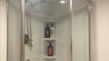 Shower, hair dryer, towels, soap
