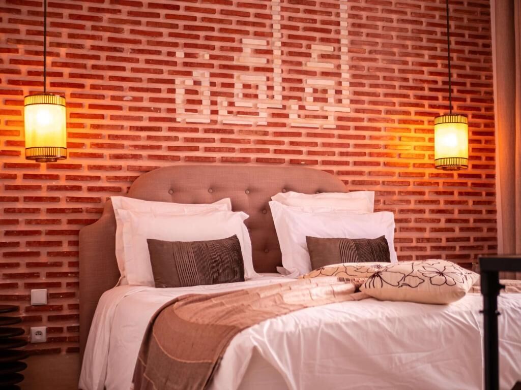 Habitación Deluxe doble, balcón, vistas al patio | Caja fuerte, cortinas opacas, sistema de insonorización