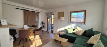 Comfortable living and dining in a house in Osterhofen-Bayrischzell.