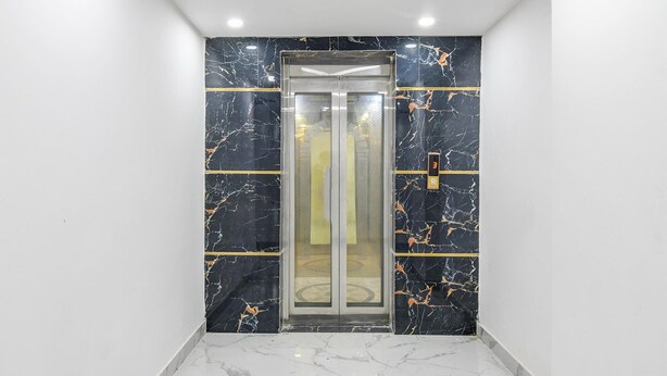 An elevator with marble walls and a modern design. - Classic With Balcony Mourigram Near Andul Road (Howrah)
