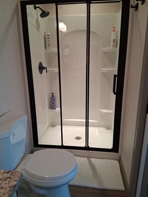 Shower, hair dryer, towels, soap