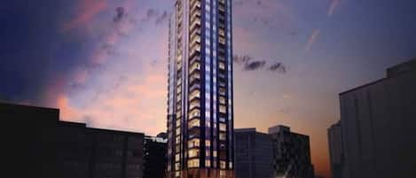 A high-rise building with multiple floors, likely a hotel or residential complex, with a modern architectural design.