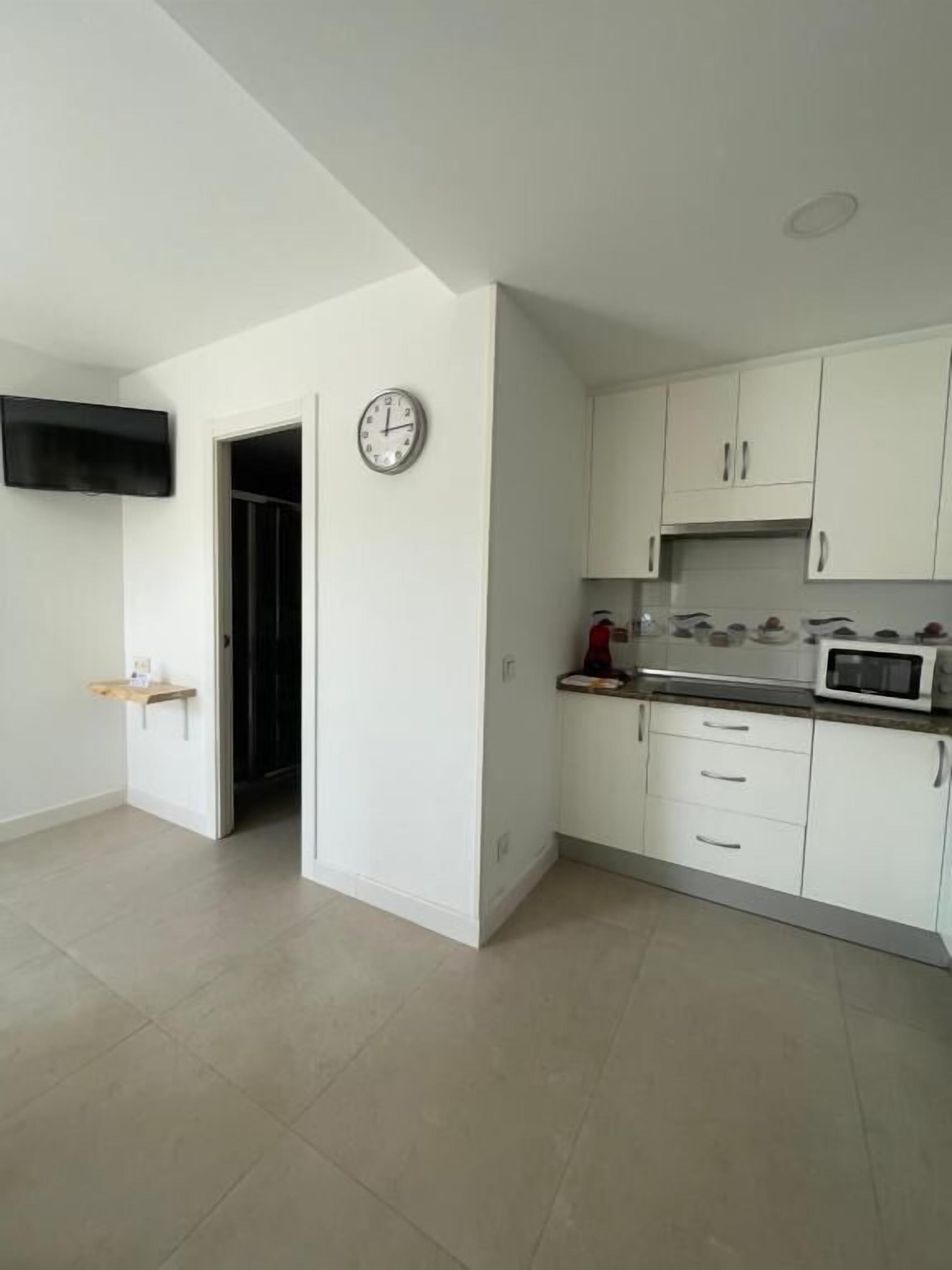 Family Room, Patio | Private kitchen