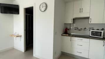 Family Room, Patio | Private kitchen