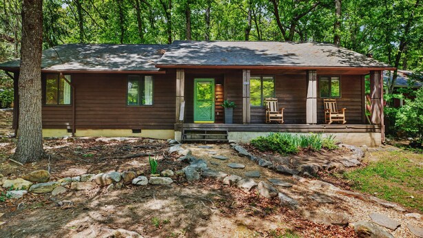 A cabin with a porch, a green door, and a number '2840' on the front. -  Mountain lodge w/ cozy fall vibes! Slps 10, Wooded views, Hot tub & fire pit (McGaheysville)