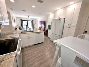 Fridge, microwave, oven, stovetop - Gulf Breezes & Beach Days - St Pete Beach Condo (St. Pete Beach)
