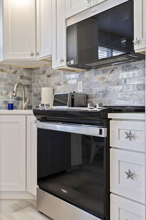 Fridge, microwave, oven, stovetop - Gulf Breeze Hideaway - Pool, Beach Access (St. Pete Beach)