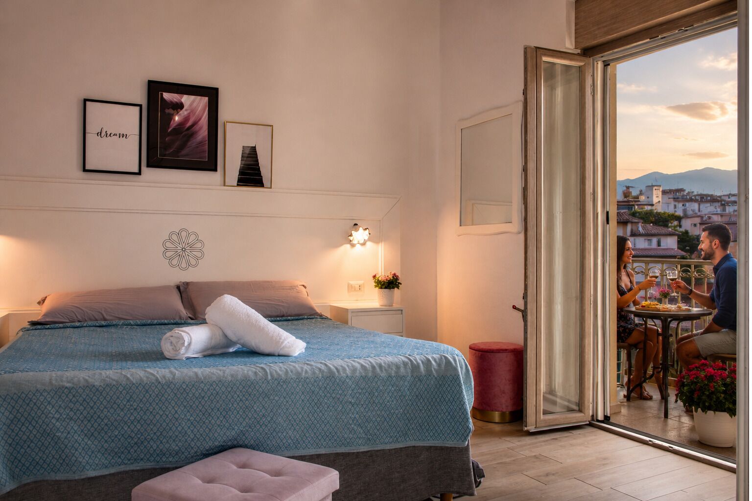 A bedroom with a bed, a bedside table, a nightstand, a mirror, and a view of the outside.