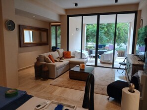 Living area - Brand new charming condo in golf community 24 hour security. (Playa del Carmen)