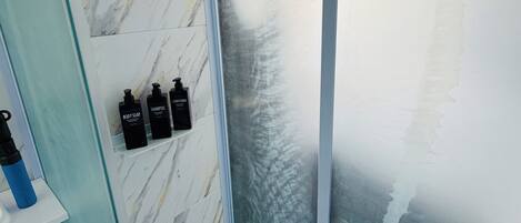 Shower, hair dryer, towels, soap