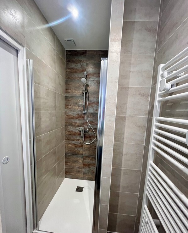 Shower, hair dryer, towels, soap