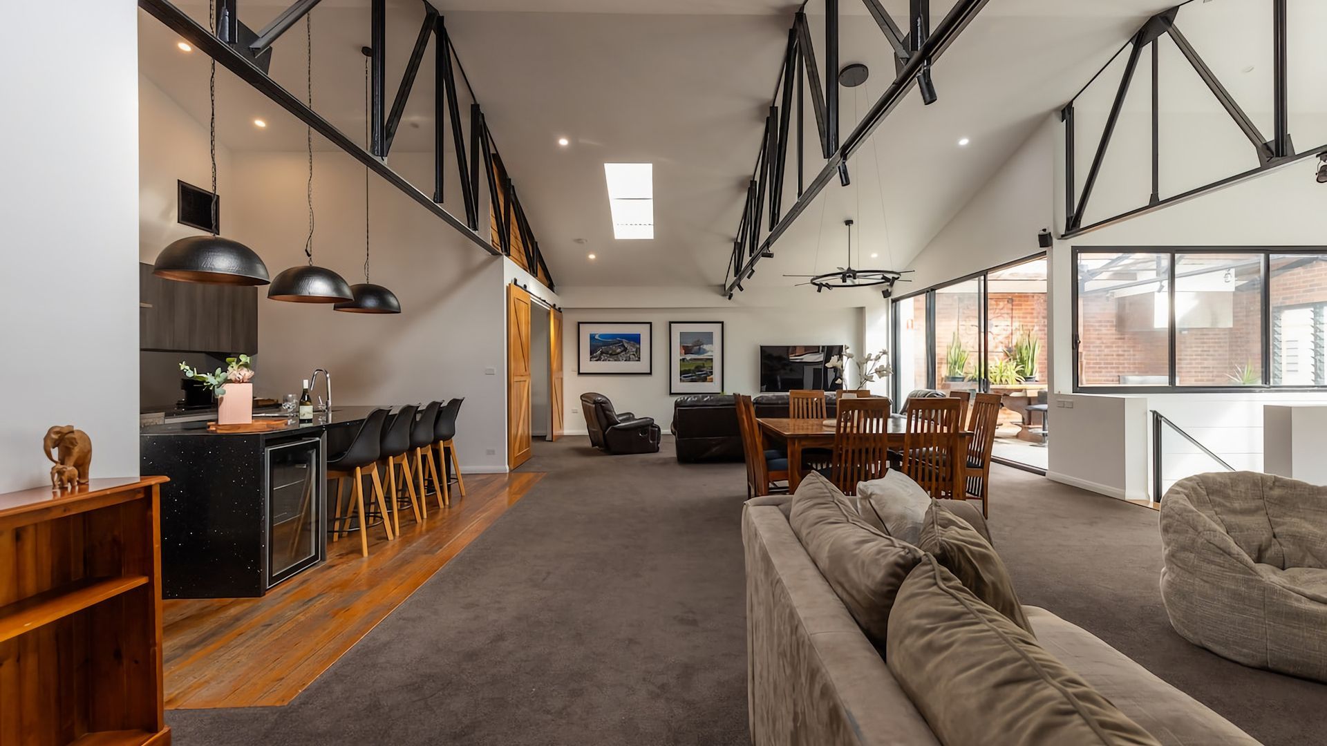 A modern interior with a kitchen, dining area, and living space.