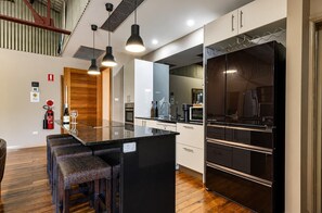 Fridge, microwave, oven, stovetop - Newcastle Modern CBD Apartment | Central and Stylish (Newcastle West)