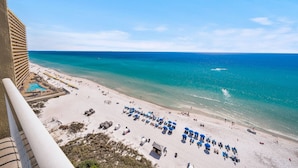 A beach with sun loungers and umbrellas, a pool, and a view of the ocean. - Seychelles 1207 (Panama City Beach)