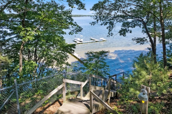About 20 wood steps with railing down to the water