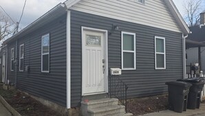 A single-story house with a white front door, a small porch, and a mailbox marked with the number 2635. - Spacious 3-bedroom house in serene Cleveland with AC (Cleveland)