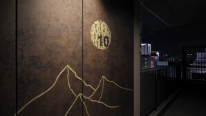 A wall with a number '10' and a mountain design. - Premium MONday ASAKUSA I (Tokyo)