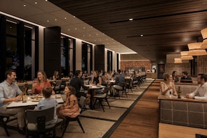 A spacious restaurant with multiple dining areas, large windows, and a modern interior design. - Premium hotel MONday MAIHAMA VIEW II (Tokyo)