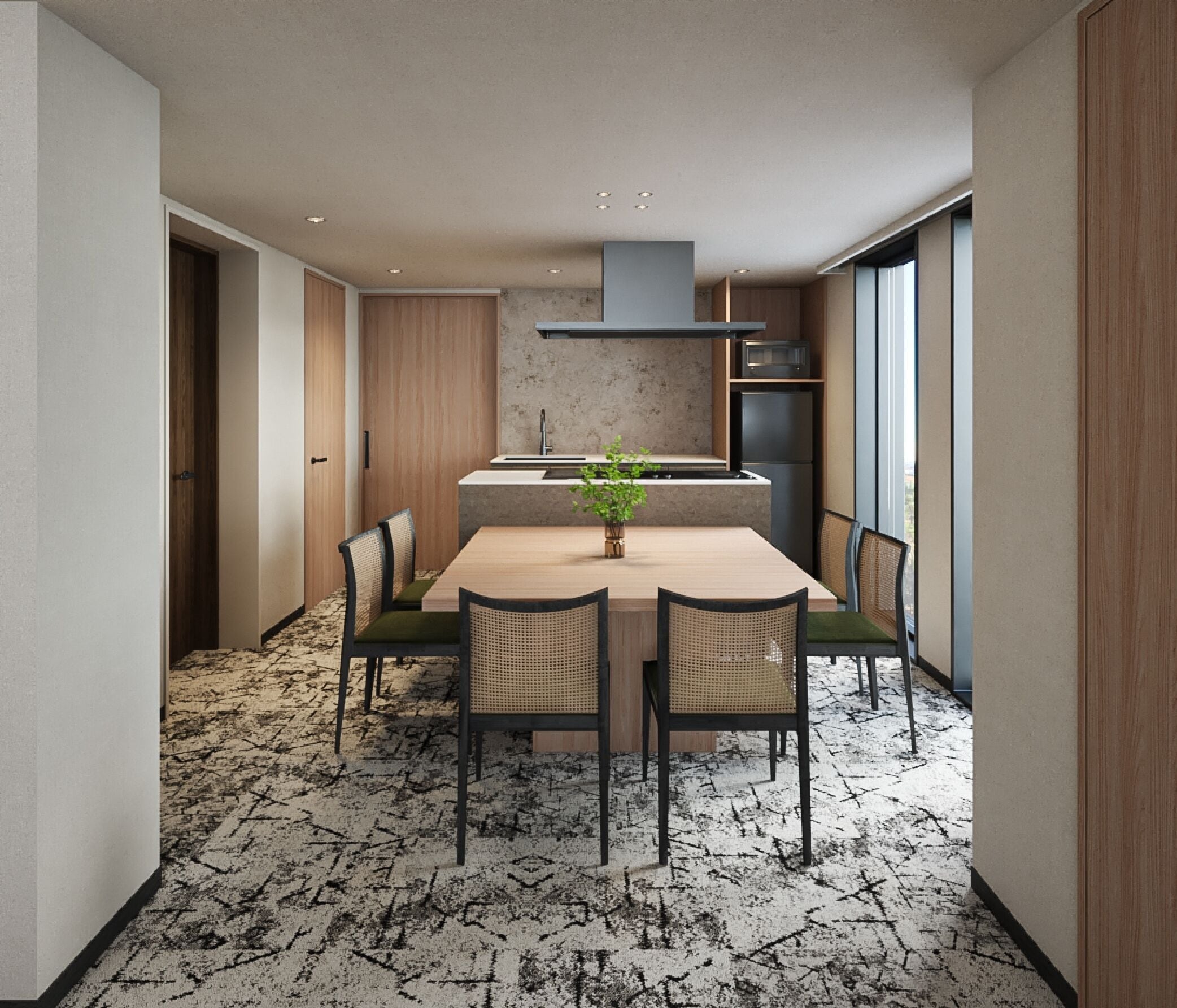 A modern kitchen with a central island, built-in appliances, and a dining area with chairs and a table.