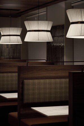 A row of booths with pleated lamps overhead. - Premium hotel MONday MAIHAMA VIEW II (Tokyo)