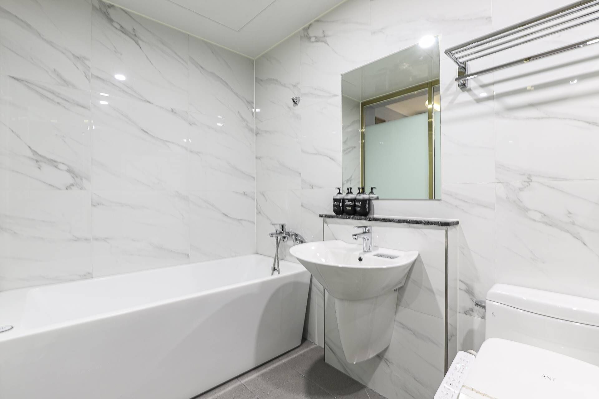 Separate tub and shower, slippers, towels