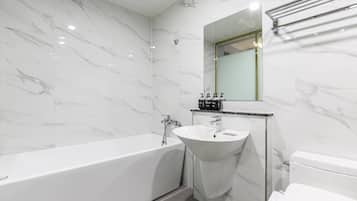 Separate tub and shower, slippers, towels
