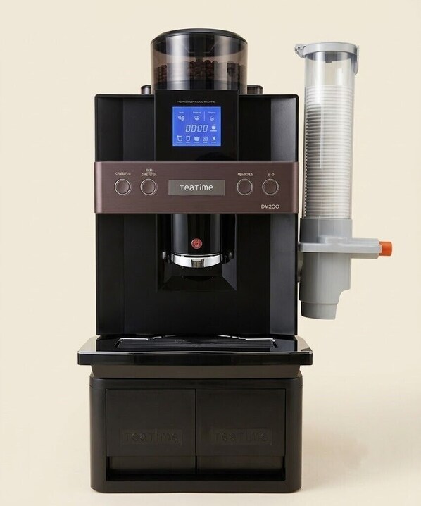 A compact, modern tea machine with a digital display, control buttons, and a water tank. - Hotel felice (Daegu)