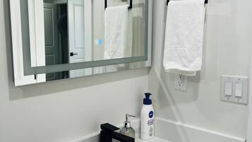 Hair dryer, towels, soap, shampoo