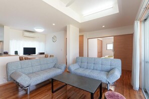 Family House, Balcony, Garden View | Living area - ASHIBINA INN (Ishigaki)