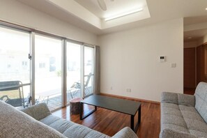 Family House, Balcony, Garden View | Living area - ASHIBINA INN (Ishigaki)