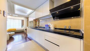 Family Triple Room, City View | Private kitchen