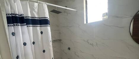 Shower, towels, soap, toilet paper