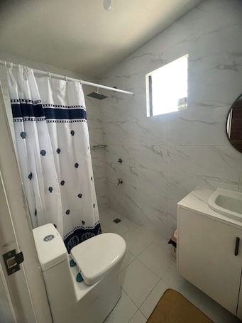 Shower, towels, soap, toilet paper. Charming 1-bedroom house with AC in Culasi