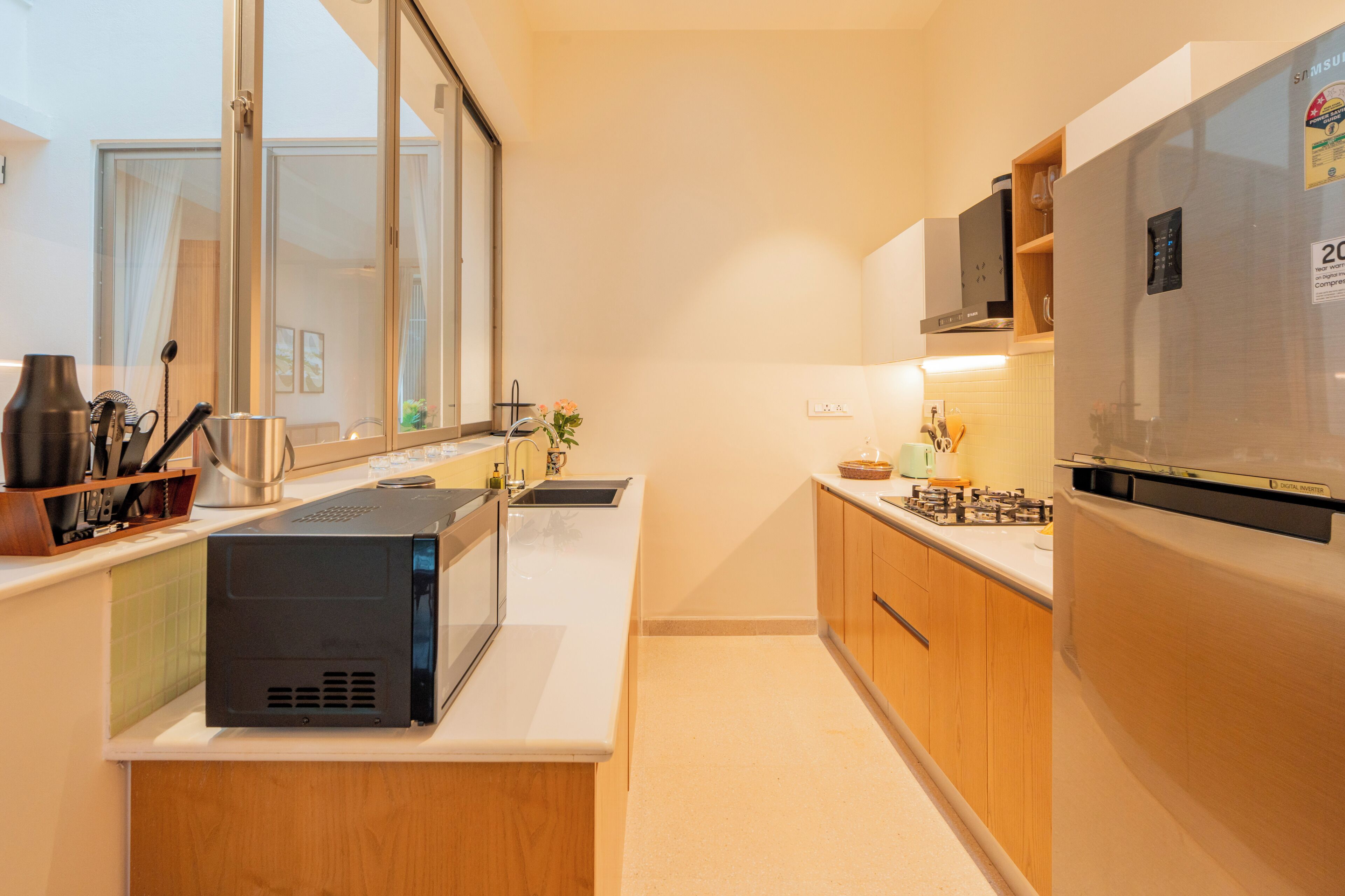 A modern kitchen with a built-in microwave, stove, and refrigerator.