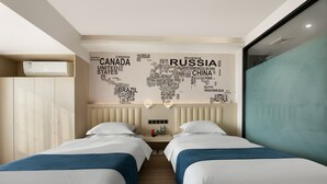 A hotel room with two beds, a world map wall art, a wardrobe, and a window. - H Hotel Xi'an Bell Tower Muslim Quarte (Xi'an)