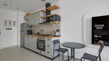 Condo, City View | Private kitchen | Full-sized fridge, microwave, oven, stovetop