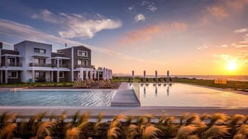 2 outdoor pools, open 9:00 AM to 7:00 PM, pool umbrellas, sun loungers