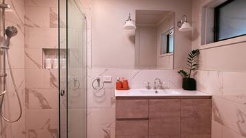 Shower, towels, soap, toilet paper