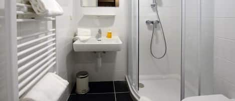 Shower, hair dryer, towels, toilet paper