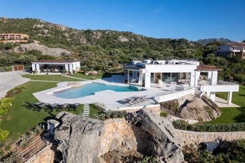 Situated in one of Porto Rotondo's most exclusive locations, this extraordinary villa is one of the most refined private residences on the prestigious Costa Smeralda. A place where contemporary architecture, Mediterranean elegance, and absolute privacy b