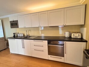 Fridge, microwave, oven, stovetop - Stables Cottage near Fort William (Onich)