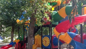 A playground with slides and a clock. - Chalet with terrace - 3 guests (Algajola)