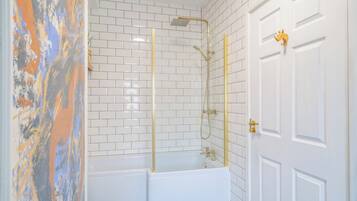 Shower, hair dryer, towels, toilet paper