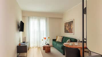 Superior Apartment | Living area | 43-inch Smart TV with cable channels
