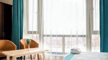 Deluxe kamer, 1 twee- of 2 eenpersoonsbedden, uitzicht op zee | Interieur