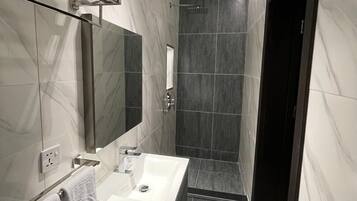 Shower, slippers, bidet, towels